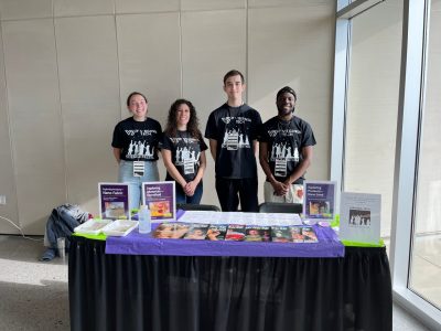 Cecilia Wood, Sylvianne Velasquez, Zachary Aycock, and Mikun Adewole host the NanoEarth booth at the VT Science Festival