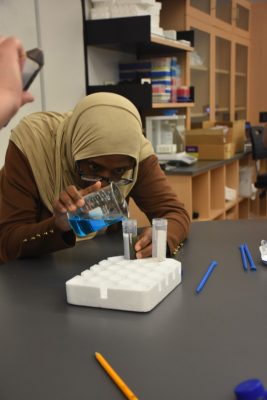measuring blue science liquid