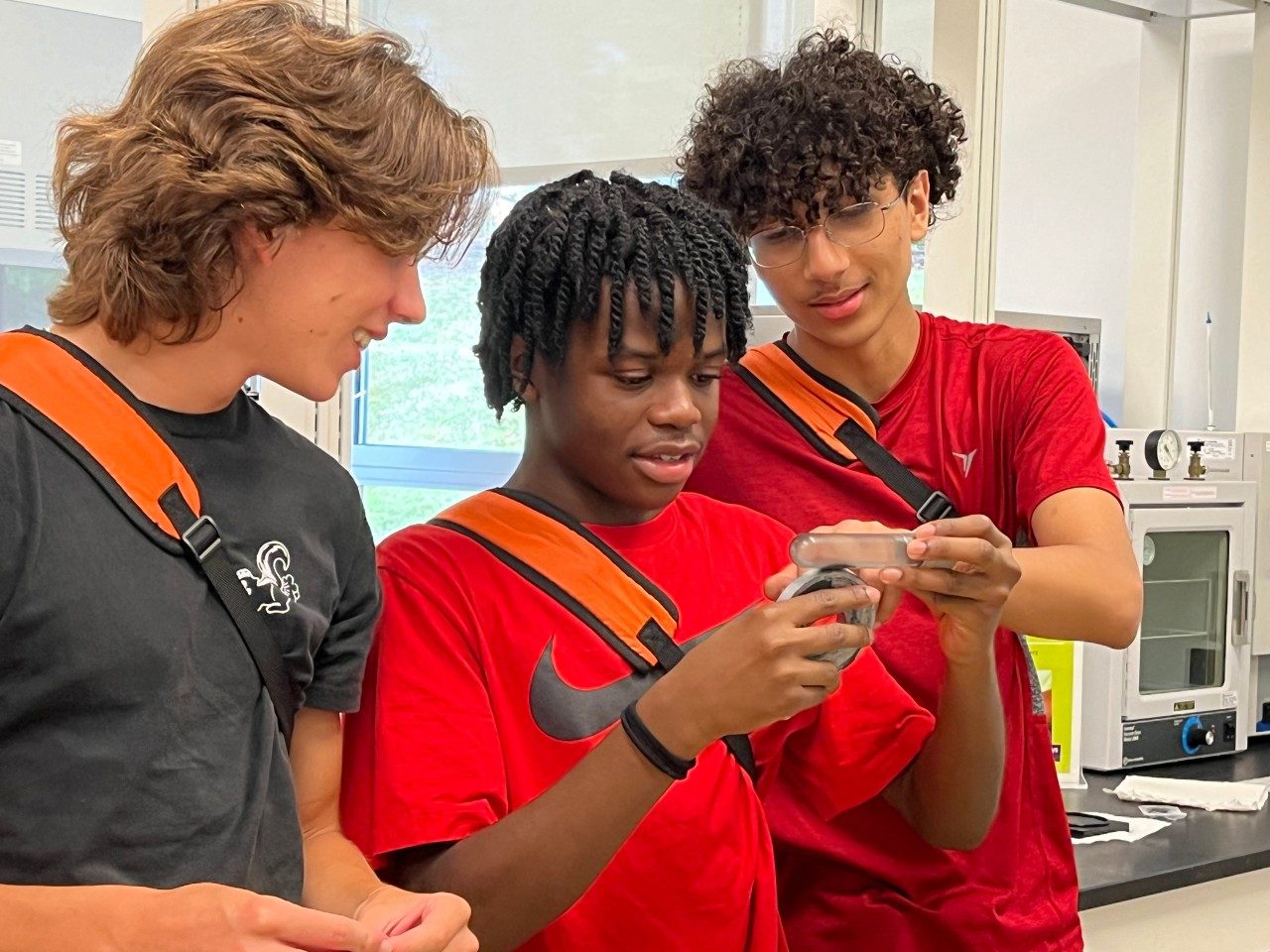 students use magnet on ferrofluid