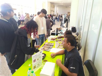 A festival attendee explores hydrophobic nano-pants with Bipin Lade