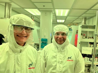 Weinan Leng and Bipin Lade participate in a cleanroom tour at Montana's Microfabrication Facility, focusing on silicon wafer processes crucial for semiconductor manufacturing, MONT