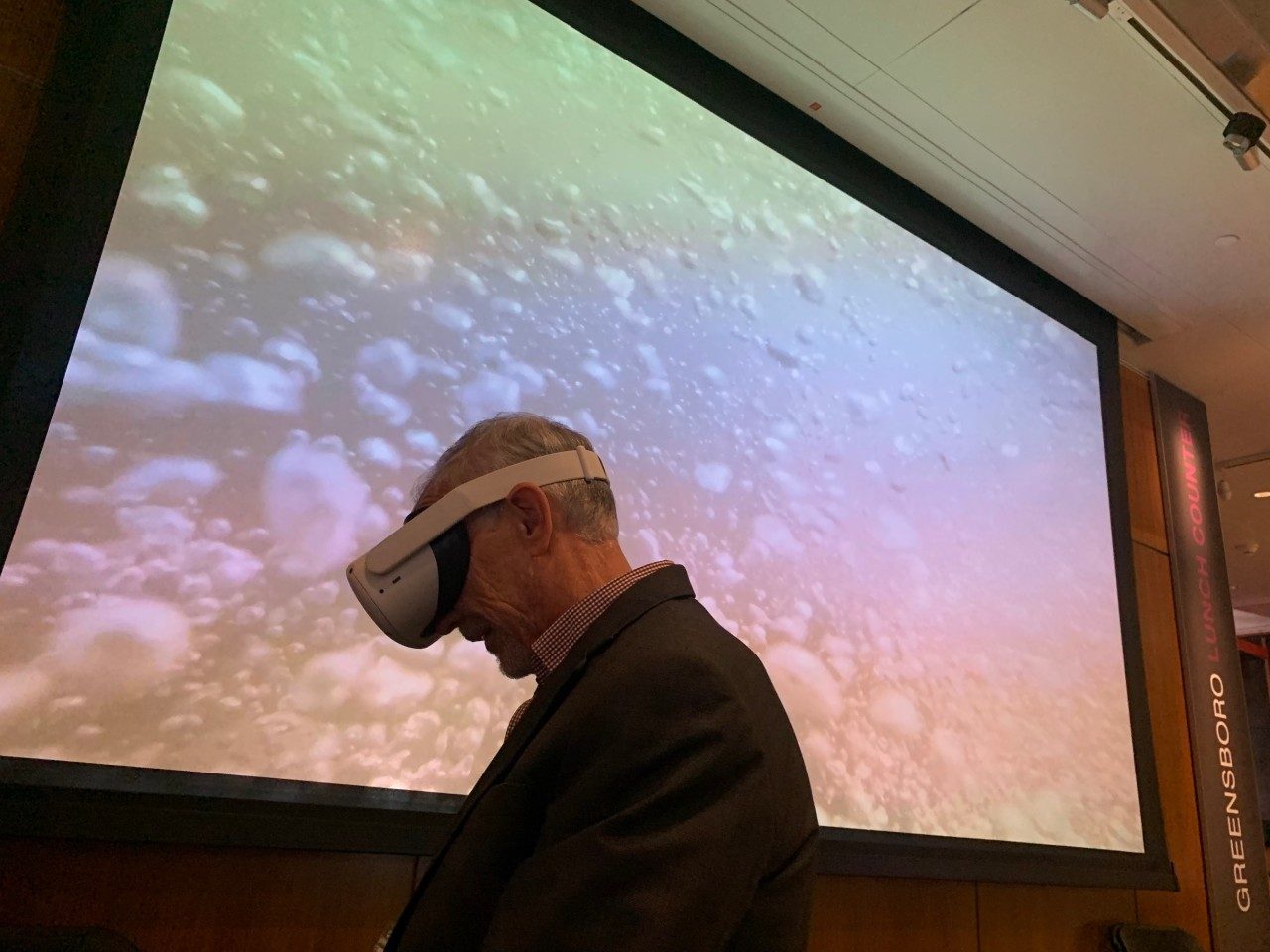 Provost Cyril Clark wearing a virtual reality headset.