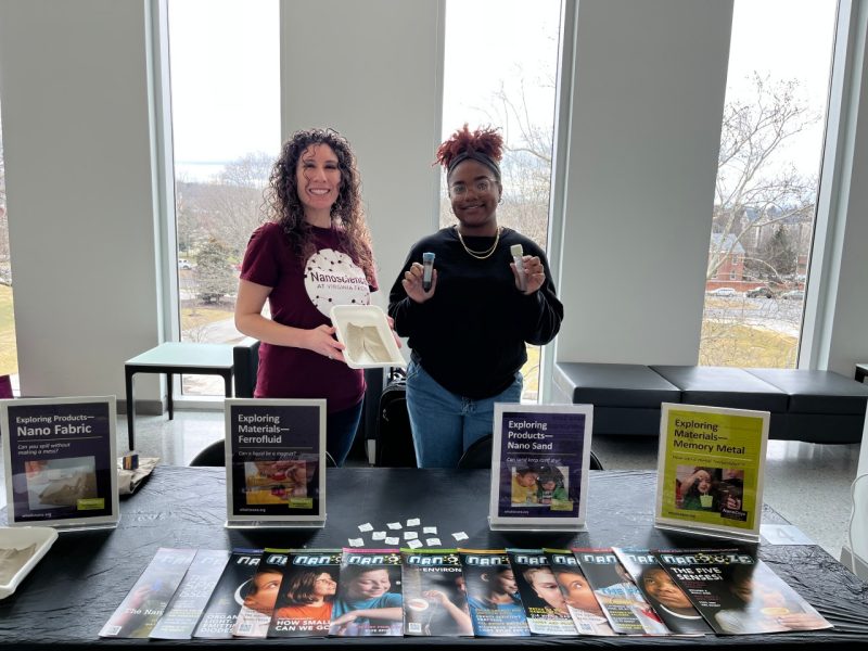 NanoEarth’s Diversity and Outreach Coordinator Sylvianne Velasquez and VT Animal and Poultry Science Undergrad Aniyah Cooke pose with NanoEarth's demo booth