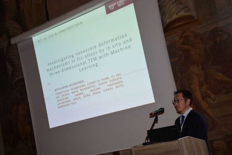 Mitsuhiro Murayama gives a presentation at a conference